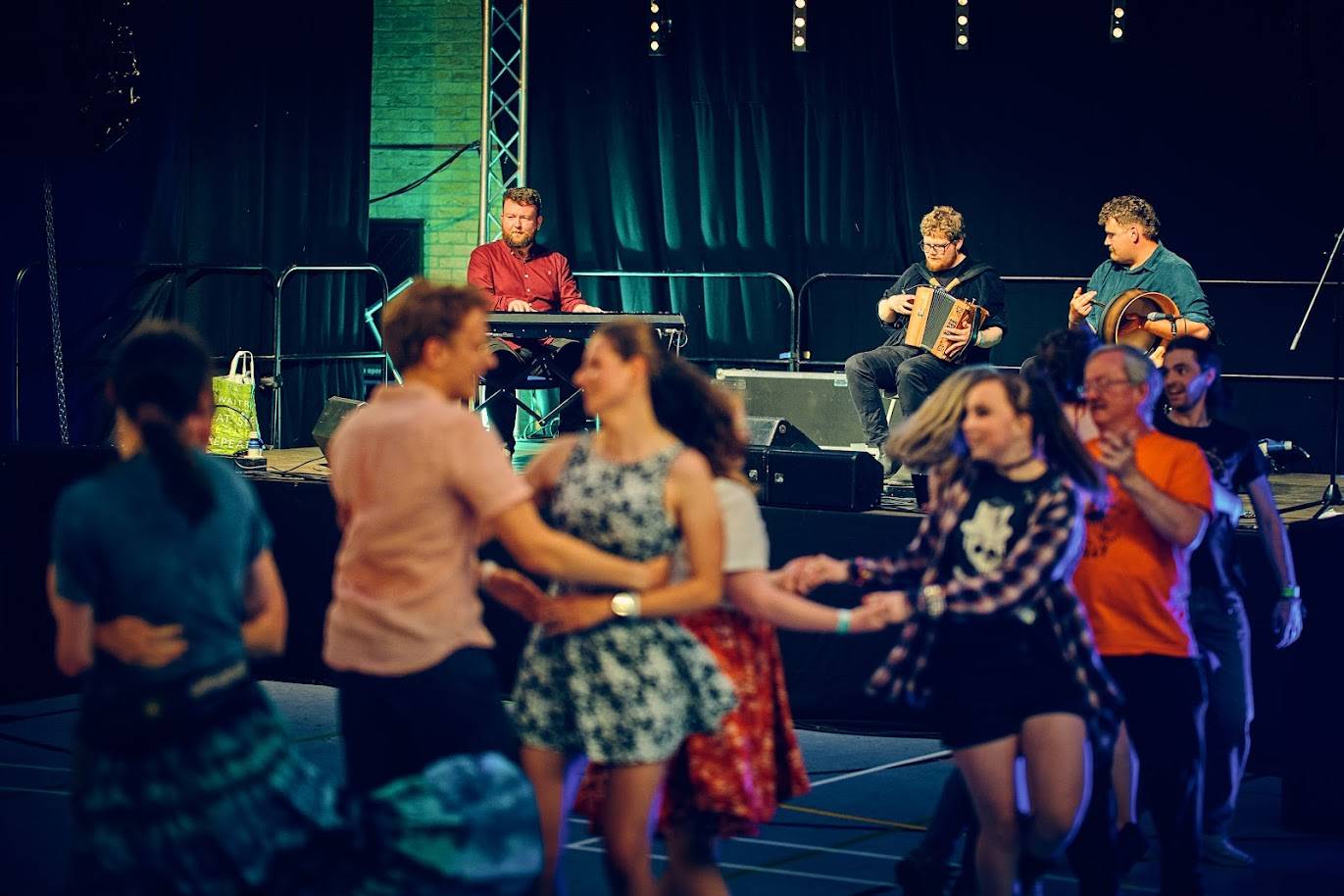 A set of dancers in a swing during the Olympiad ceilidh